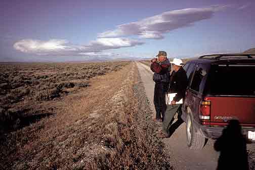 KA. Smith and J. Rensel along historic intercontinental railroad grade on the Peplin Mountain, UT BBS route 85251  (photo by K. Evans - 2001).